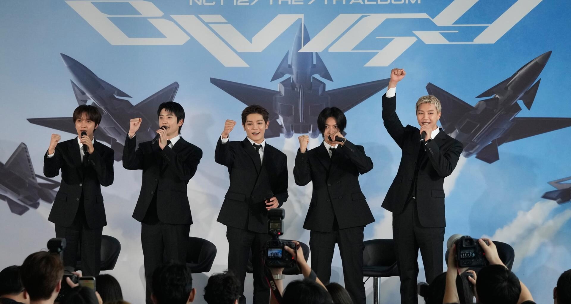 Members of K-pop group NCT 127 pose during a press conference to introduce their new album