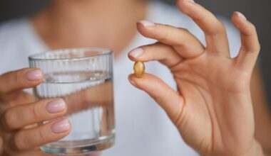 Woman Taking Vitamin D Omega 3 Supplement Pill
