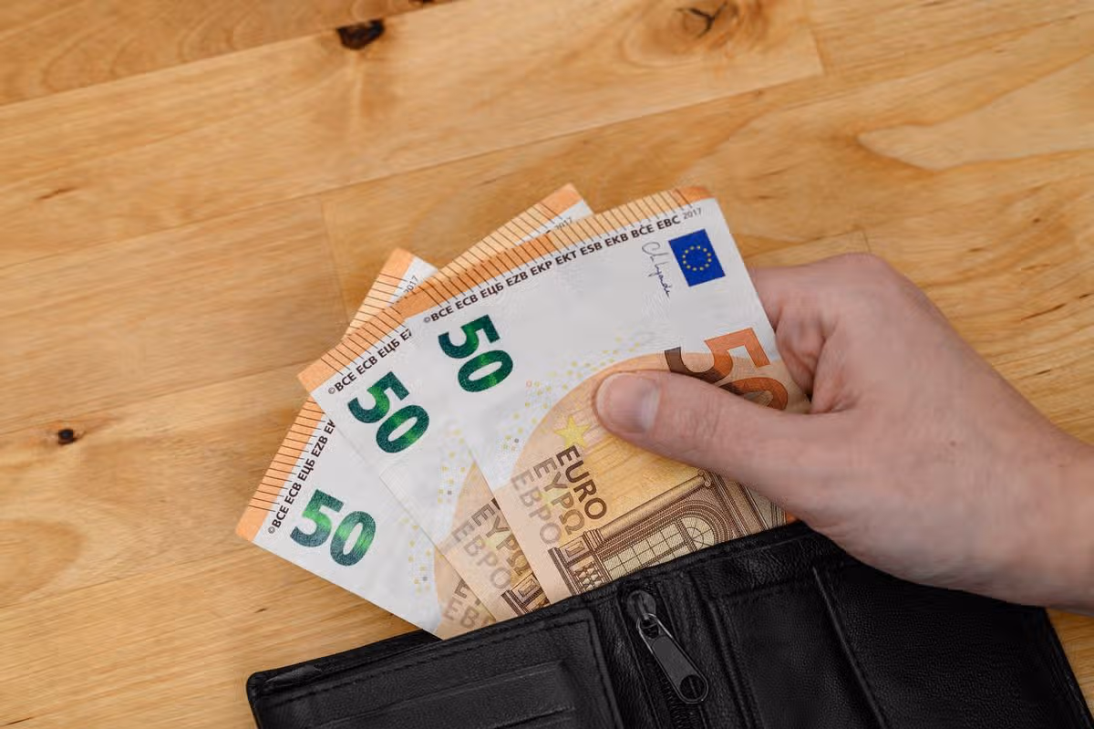 Wallet filled with euro notes