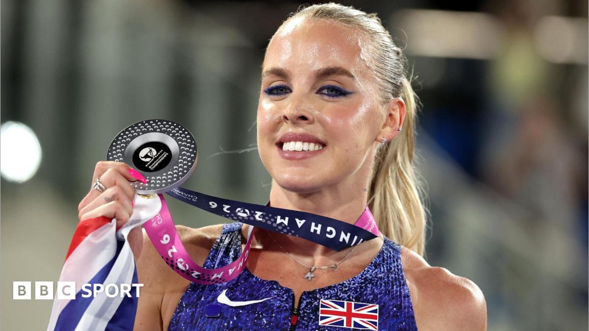 Keely Hodgkinson in a crown with her coaches in the background