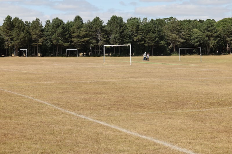 Grass soccer pitches have dried out and turned yellow at St Anne's Park in Dublin. Photograph: Alan Betson