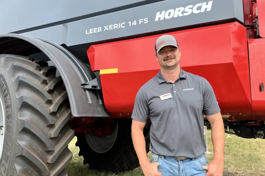 Mike Wasylyniuk, product manager for sprayers at Horsch, standing beside the Leeb Xeric fertilizer spreader. Photo: Greg Berg