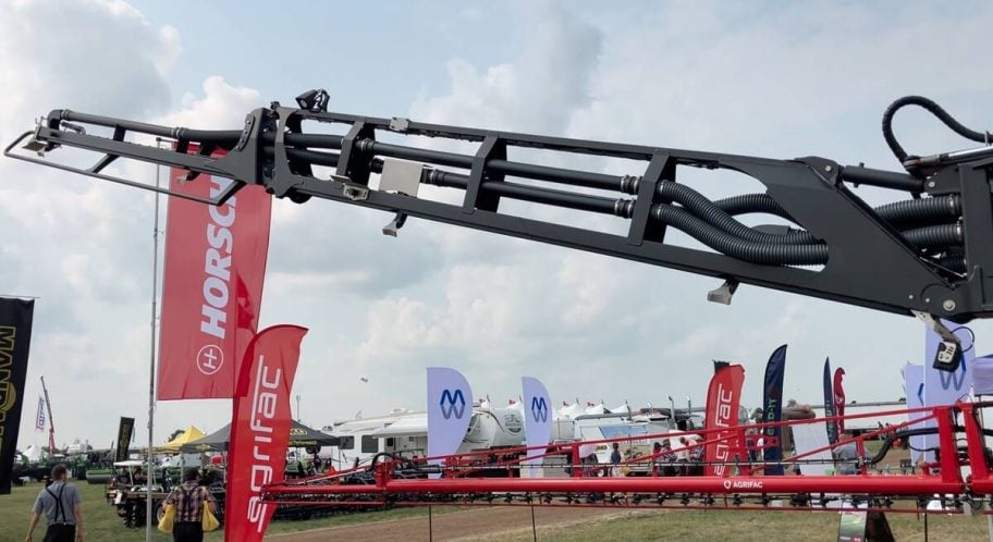 The flex boom on the Leeb Xeric spreader helps keep the far ends of the 160-foot boom from getting too close to the ground in uneven terrain. Photo: Greg Berg