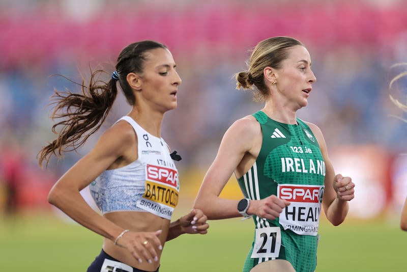 Sarah Healy alongside eventual winner Nadia Battocletti of Italy during the women's 5,000m. Photograph: Morgan Treacy/Inpho