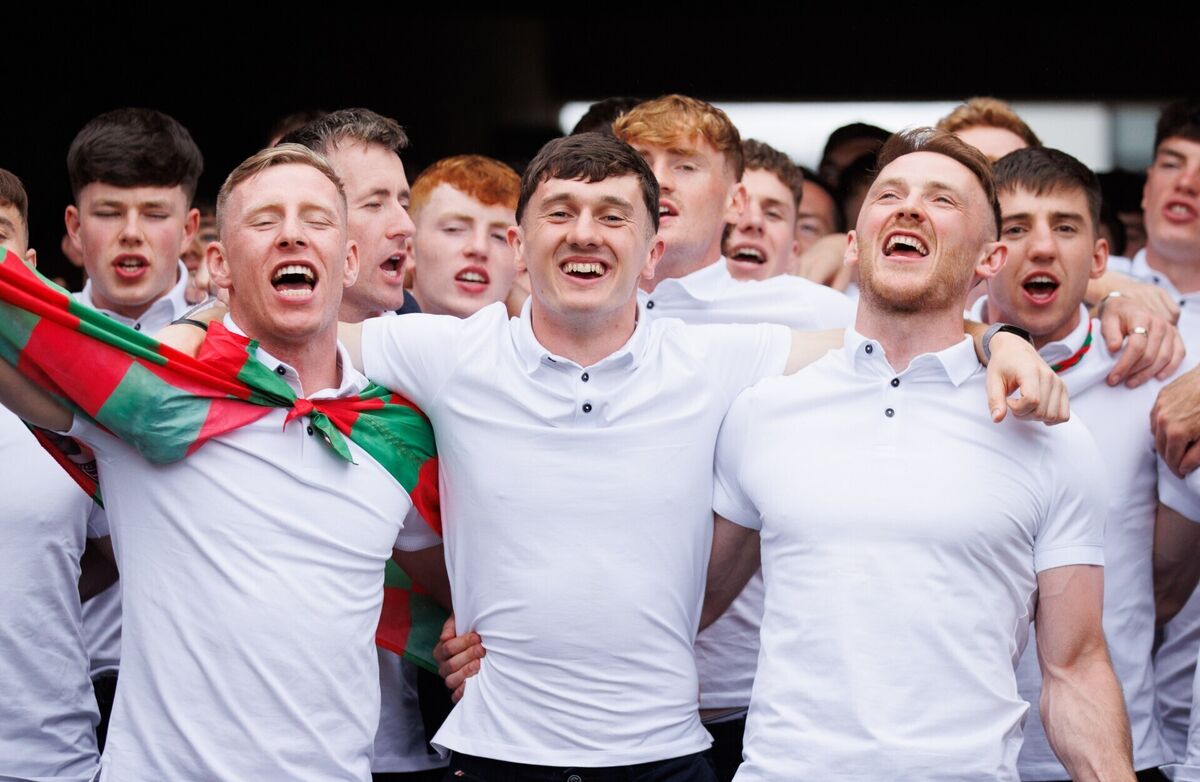Mayo's Ryan O'Donoghue, Jack Coyne, and Darren McHale celebrate at the homecoming. Picture: Tom Maher/Inpho