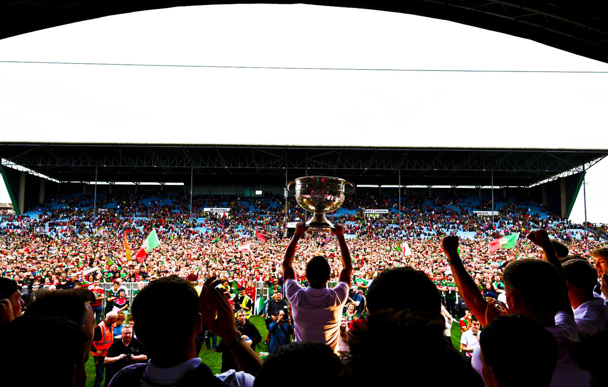 Mayo supporters celebrate as the Sam Maguire Cup is held aloft during the homecoming celebrations at MacHale Park on Monday. Picture: Piaras Ó Mídheach/Sportsfile