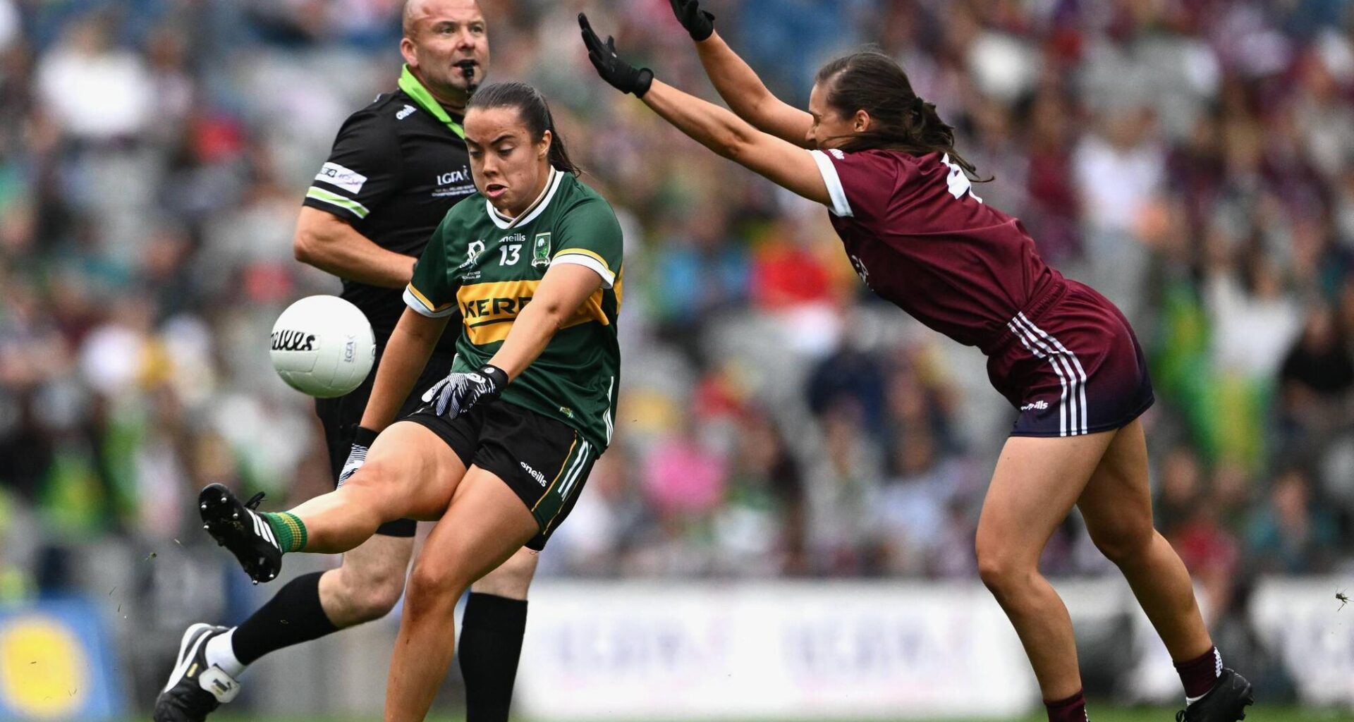 Danielle O'Leary of Kerry kicks past Kate Geraghty of Galway. Pic: Ray McManus/Sportsfile