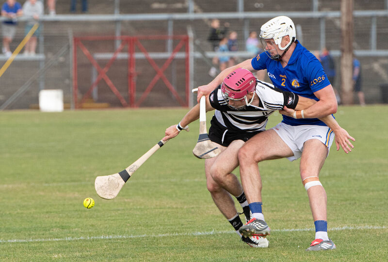 Midleton's Alex Quirke tussles with Ciarán Doolan of St Finbarr's. Picture: Howard Crowdy