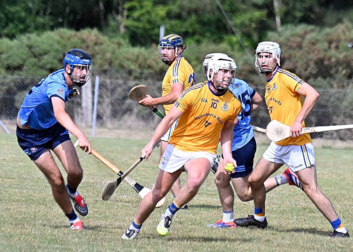 St Finbarr's Caolan O'Connor passes the sliotar as Barryroe's Jack Murphy closes in the Co-Op Superstores Premier Junior Hurling Championship game in Belgooly. Picture: Martin Walsh.