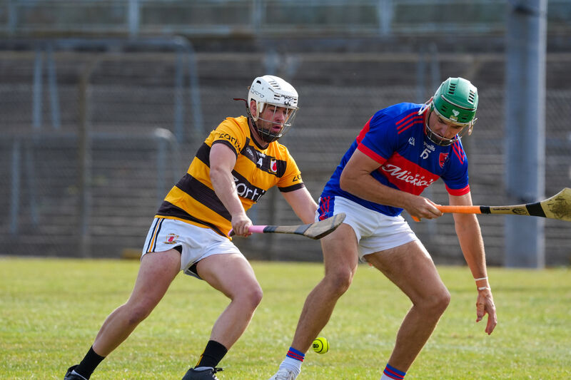 Na Piarsaigh’s Aaron Higgins ans Erins Own’s Conor Lenihan battle for possession. Picture: Noel Sweeney