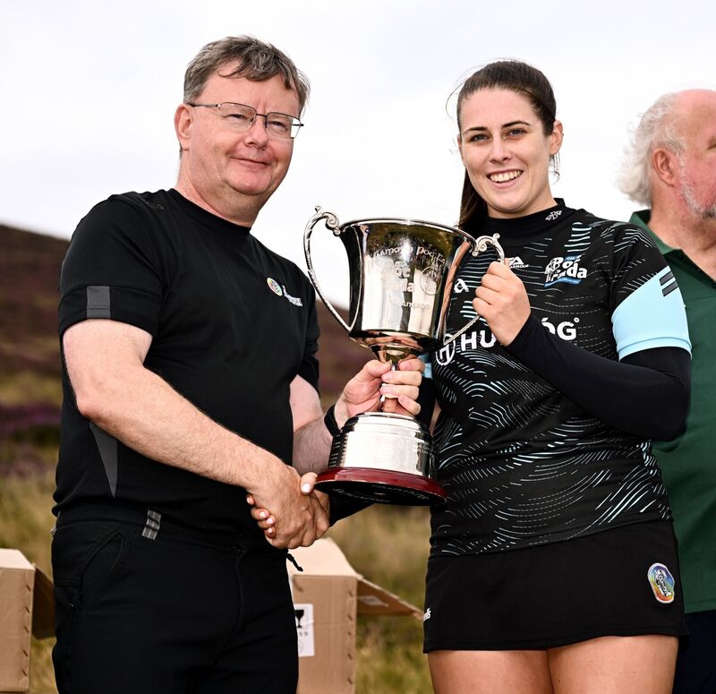 Uachtarán an Cumann Camógaíochta Brian Molloy with senior camogie winner, Molly Lynch, after the M. Donnelly GAA Poc Fada All-Ireland final at Annaverna Mountain in Cooley Peninsula, Louth. Photo by Ben McShane/Sportsfile