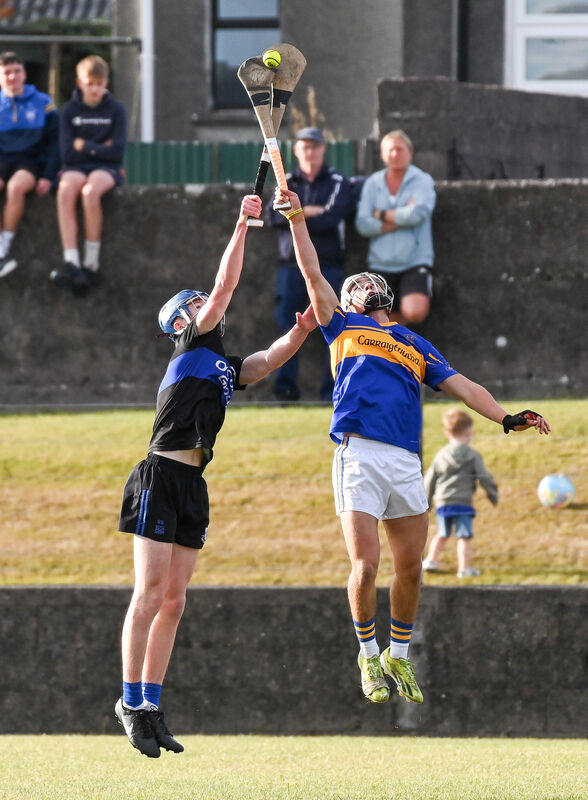  Carrigtwohill's Tom Walsh and Sarsfields' Seán Sheehan compete in the air during their Premier 1 MHC clash at Carrigtwohill. Picture: David Keane