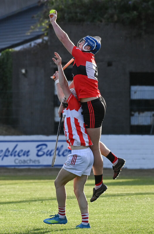 UCC's Kevin Beechinor goes high to win possession ahead of Imokilly's Sean O'Donoghue. Picture: David Keane.