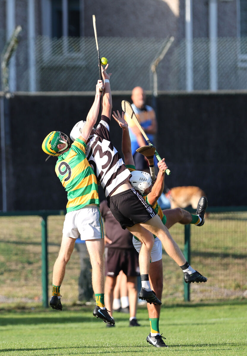 Conor Stack and Kevin Long, Blackrock, and Shane O'Mahony, Midleton, battling for aerial possession. Picture: Jim Coughlan.