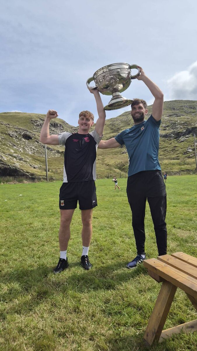 Jack Carney and Aidan O'Shea on Inishturk island with Sam Maguire