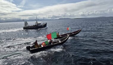 Here they come: The ferry carrying Sam Maguire is escorted across from the mainland to Inishturk Island off Mayo.