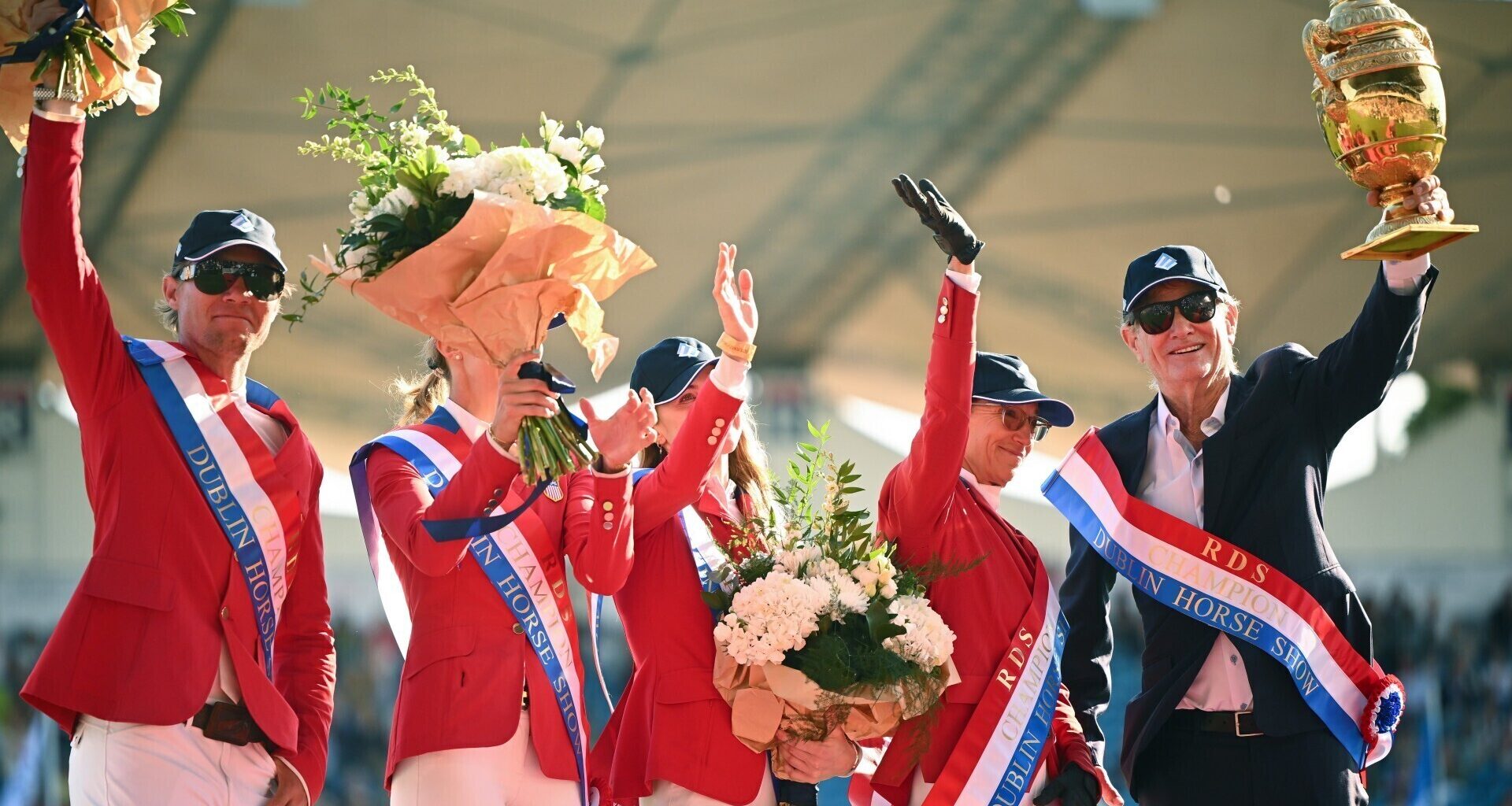 Team USA members, from left, Karl Cook, Natalie Dean, Robert Ridland, Laura Kraut and Paris Sellon celebrate with the Aga Khan trophy. Pic: Shauna Clinton/Sportsfile