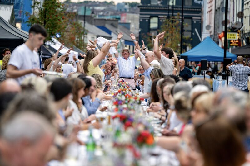 Liam Maher leads the Mexican wave at the Cork on a Fork Long Table event on McCurtain Street. Picture: Chani Anderson