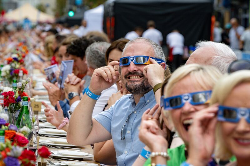 Diners at the Cork on a Fork Long Table try out their solar glasses courtesy of the Blackrock Castle Observatory. Picture: Chani Anderson