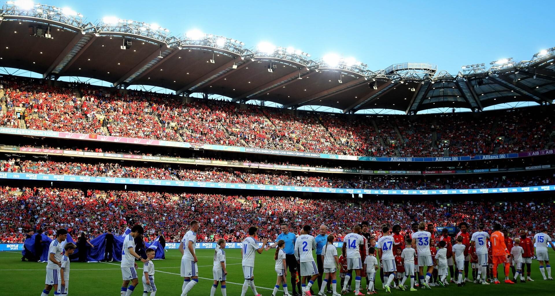 FULL HOUSE: Manchester United and Leeds United players shaek hands before Wednesday's pre-season Friendly, Croke Park, Dublin. Pic: INPHO/Ryan Byrne