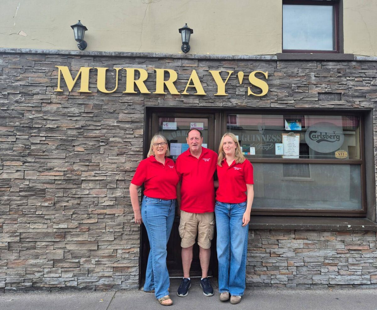 Denis and Tina Murray with one of their daughters, Jane, outside Murray’s Bar in Macroom. The couple have run the pub since 1996