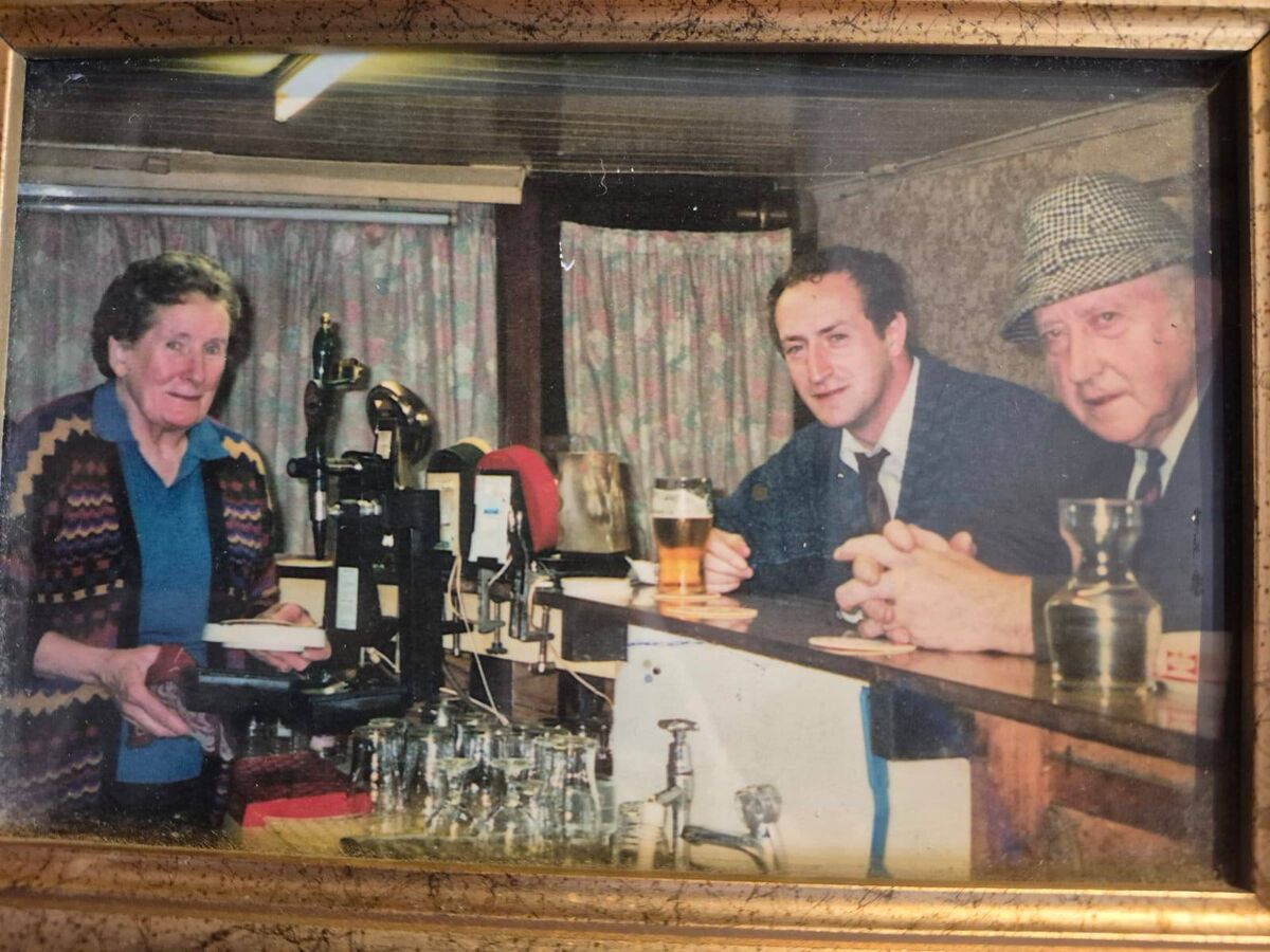 Sheila, known as ‘Mother’, Denis Jr, and Denis Sr, known as ‘The Boss’, in Murray’s bar in Macroom