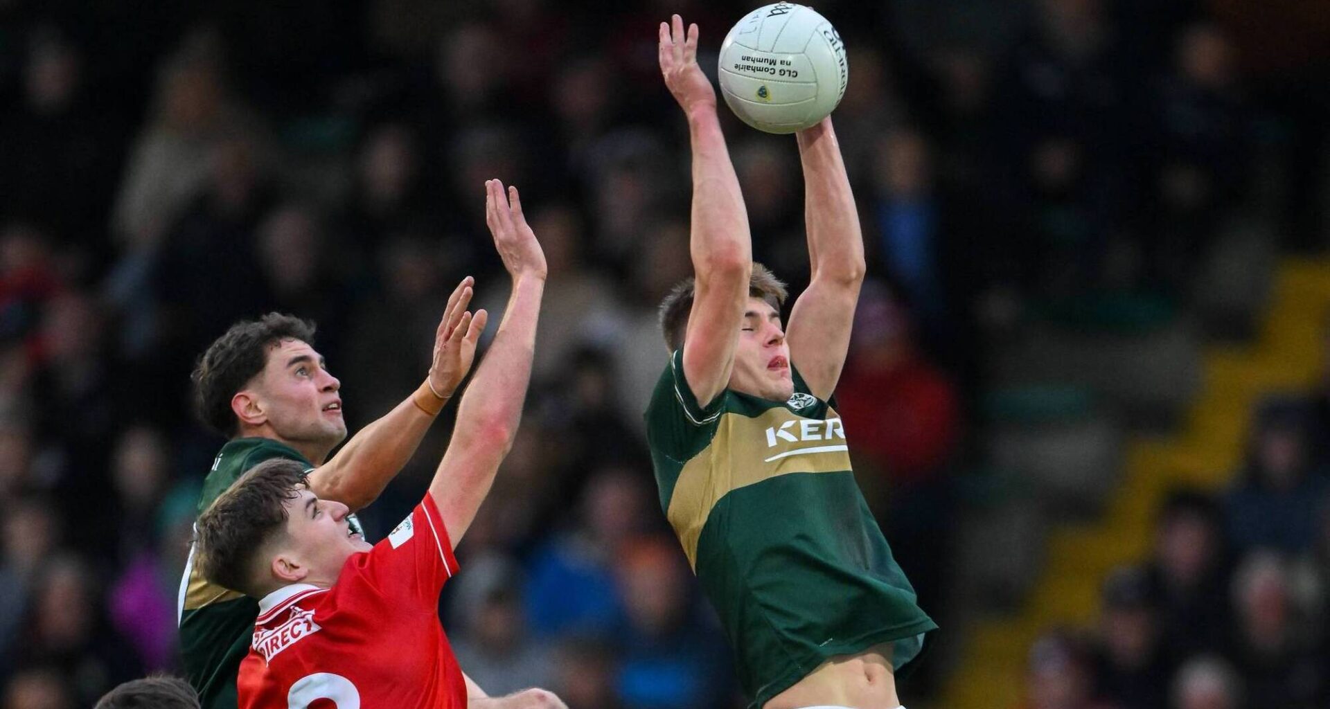 AFL-BOUND? Daniel Kirby of Kerry catches a kickout ahead of teammate Evan Boyle and Darragh Clifford of Cork. Pic:  Brendan Moran/Sportsfile