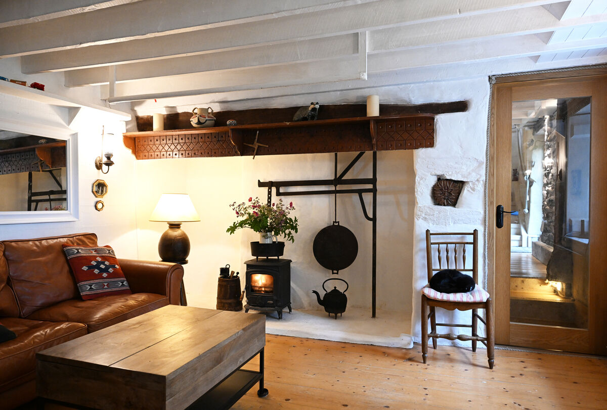 A stove in the traditional style farmhouse fireplace. 