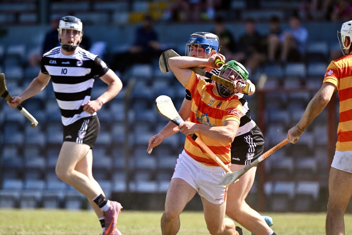  Micheál McSweeney of Newcestown is caught by a high challenge from Conor Morley of Midleton. Picture: Larry Cummins