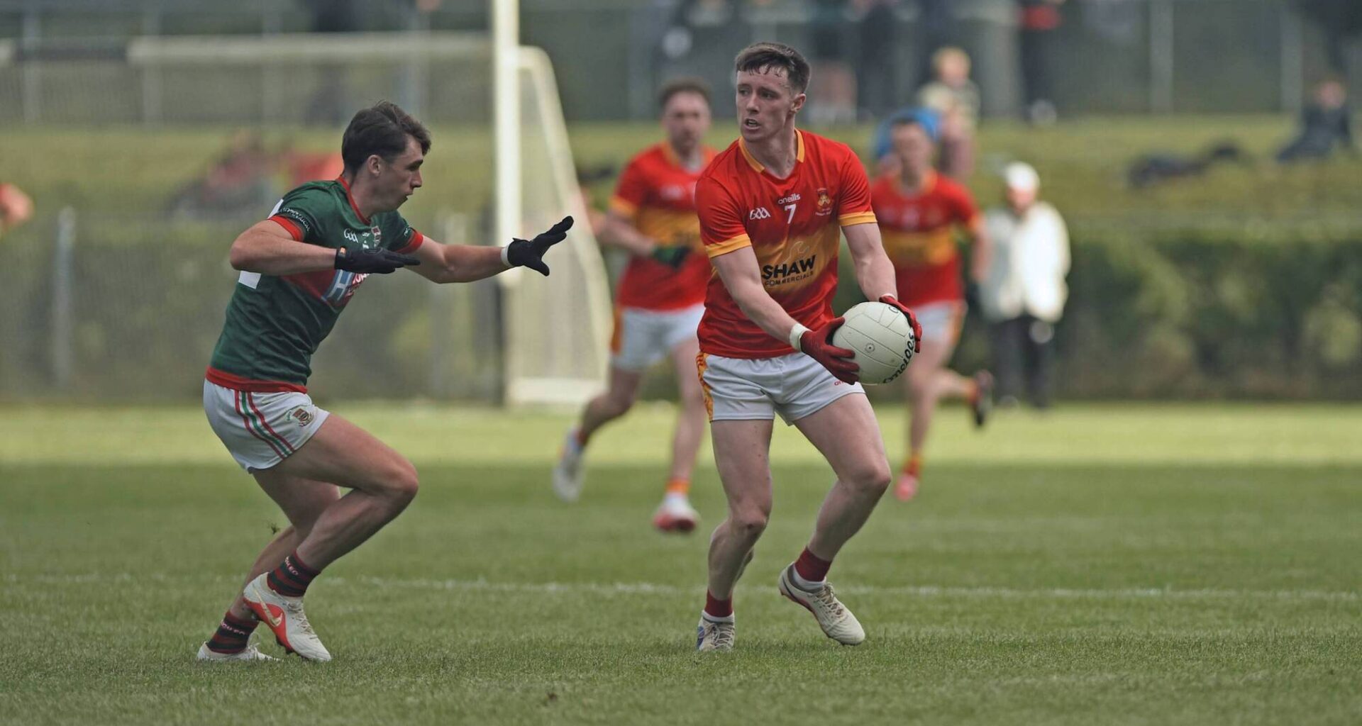 Castlebar Mitchels Sean Morahan looks to get past Ballina Stephenites Sam Callinan. Pic: Conor McKeown