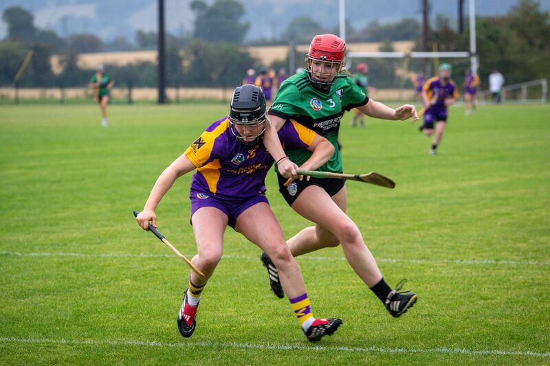 St Catherine’s Ally Mulkerrins and Killeagh’s Emily Brenner chase possession. Picture: Chani Anderson