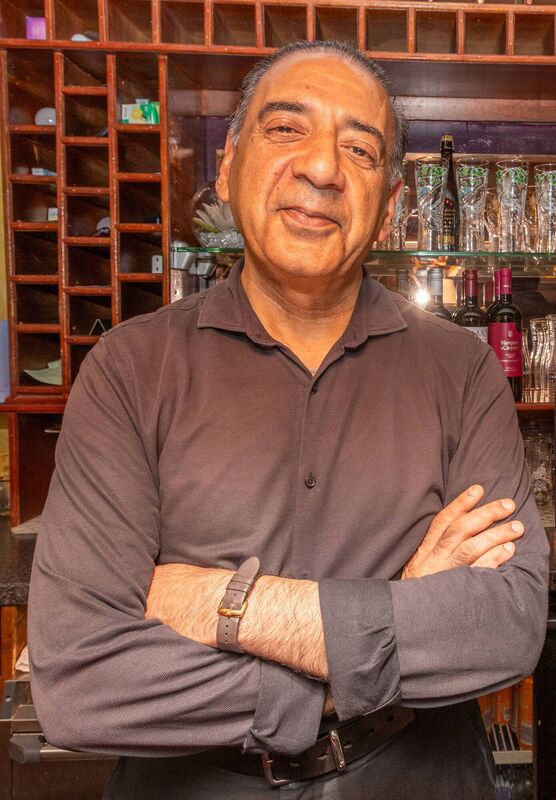Shahzad Rashid was working when a 'river' rushed through his College St restaurant in Killarney. Picture: Neil Michael
