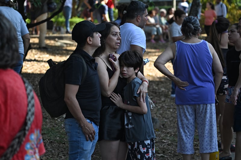 People gather at a park after evacuating their homes due to an earthquake in Cali, Colombia. Photograph: Joaquin Sarmiento/AFP via Getty Images