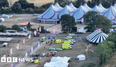 Big Church Festival 'devastated' as man dies after sign falls - BBC