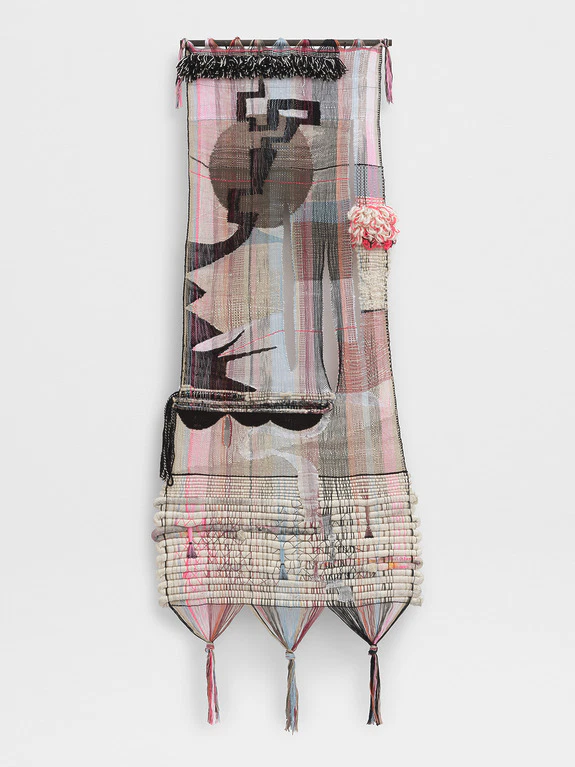 Colorful woven tapestry with abstract patterns and textures featuring pink, black, and beige hues.