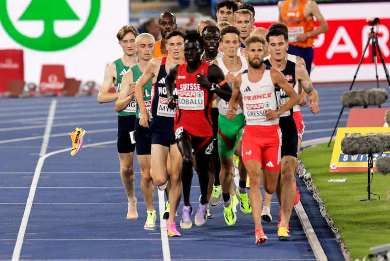 Ireland’s Nick Griggs loses his shoe during the race men's 5,000m final. Photograph: Morgan Treacy