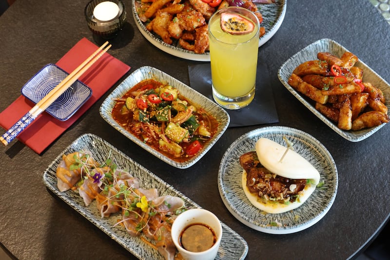 Big Mac bites (bottom), hong shao pork belly (right), smashed cucumber salab (left), Yibu spice bag (top), golden hour cocktail and aubergine popcorn (top right). Photograph: Alan Betson/The Irish Times