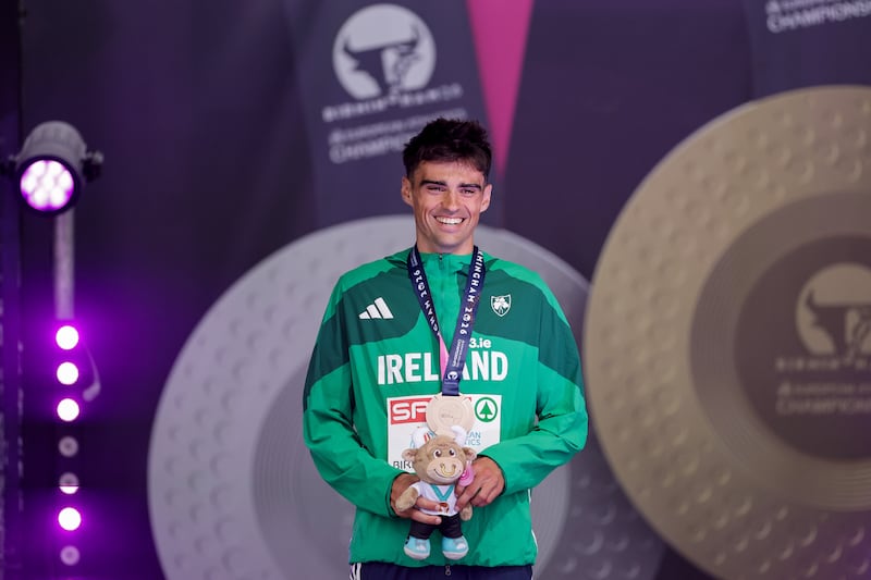 Andrew Coscoran receives his bronze medal from the men's 1,500m. Photograph: Morgan Treacy/Inpho