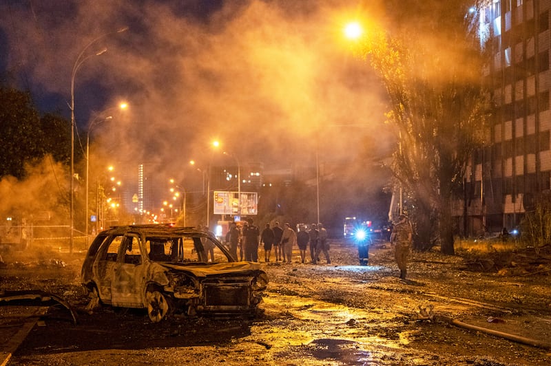 A burned car is seen after a Russian missile attack in Kyiv (Dan Bashakov/AP)