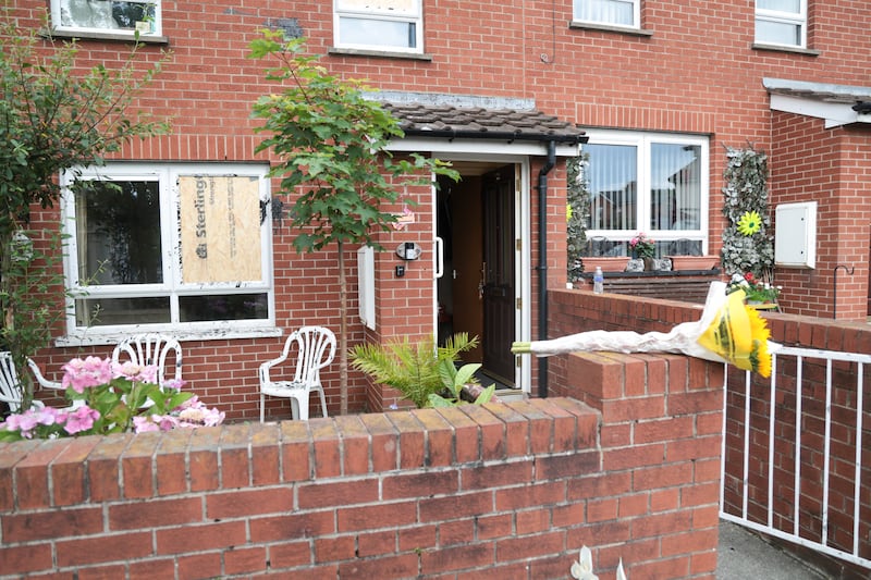 Residents leave their home after its windows were smashed and the property was vandalised with a substance in an overnight racist attack on Church Road, Holywood. PICTURE: BRIAN LINCOLN