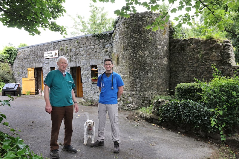 Veterinary surgeons Frank Brody and his son Justin outside their Athenry Pet Clinic, which is attached to one of Athenry's towers and walls. Photograph: Joe O'Shaughnessy