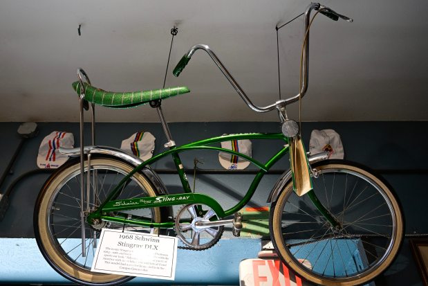 A Campus Green 1968 Schwinn Stingray DLX with a coaster brake is seen in the Bike Museum at University Bicycles in Boulder on July 23. The bicycle makes an appearance in the documentary film "No Hands: The Wild Ride of the Schwinn Bicycle Company." (Matthew Jonas/Staff Photographer)