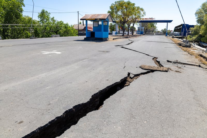 Cracks on a road after a 7.7 magnitude earthquake in East Nusa Tenggara province, Indonesia. Photograph: Made Nagi/EPA
