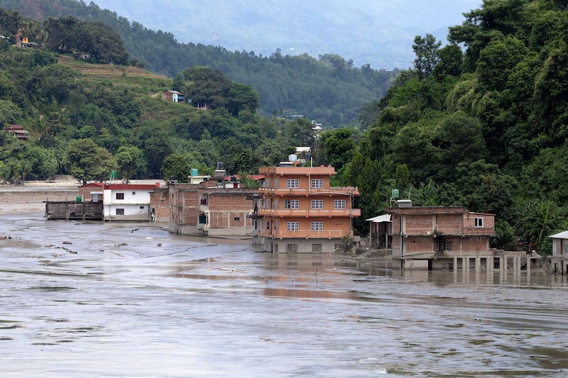 Submerged houses along the banks of the Trishuli river in Dhading district, Nepal, on Sunday. Photograph: Narendra Shrstha/EPA