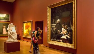 Grant Hayes and Yvette Gonzalez-Quevedo examine Thomas Eakins' "The Gross Clinic" at the Philadelphia Museum of Art.