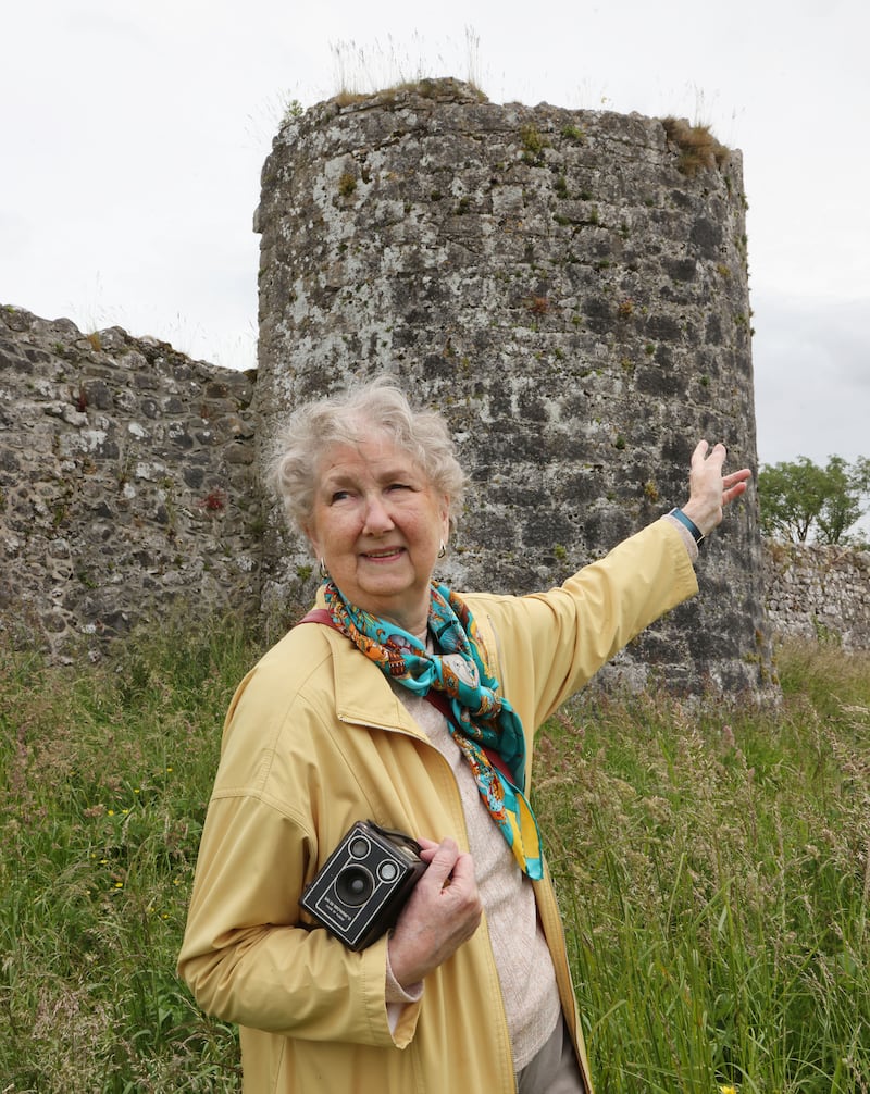 Anne Zonenblick at the tower and wall beside Kenny Park GAA grounds. Photograph: Joe O'Shaughnessy
