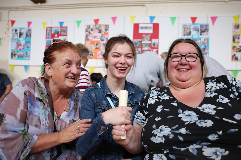Amy Bracken (18), holds her Leaving Certificate with her mother Cheryl Bracken (right) and neighbour Elaine Hewitt (left). For the first time ever, students with special educational needs who have undertaken the L1 and L2 learning programme modules received their results on the same day as other Leaving Certificate students at St. Catherine's Special School in Newcastle, County Wicklow. Photograph by Clodagh Kilcoyne/The Irish Times