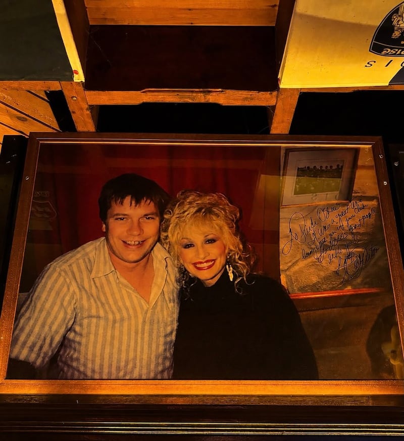 Dolly Parton with Páidí Ó Sé during her visit to his pub in Ventry, Co Kerry in 1990. Photograph: Páidí Ó Sé’s Pub/Facebook
