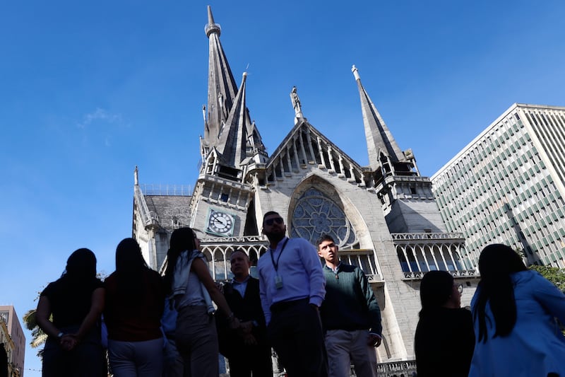 Residents stand outside the Cathedral of Manizales after it was damaged in the earthquake. Photograph: John Jairo Bonilla/AP