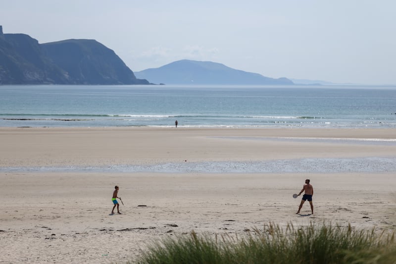 Beachgoers enjoy a game at Keel in Achill, Co Mayo. Photograph: Enda O'Dowd